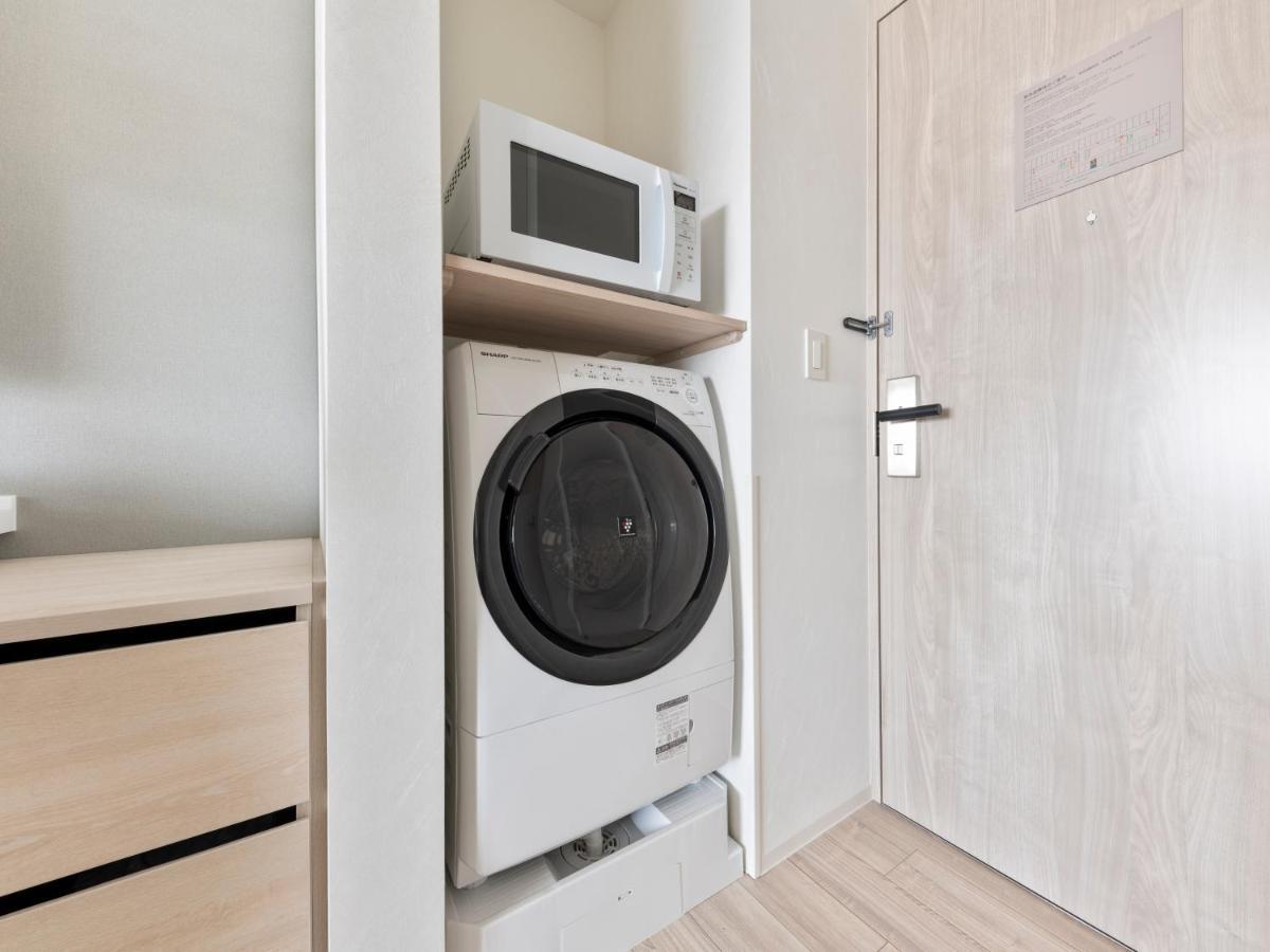 Mitsui Garden Hotel Yokohama Minatomirai Premier מראה חיצוני תמונה A washing machine and a microwave oven